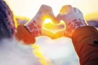 Woman hands in winter gloves Heart symbol shaped Lifestyle